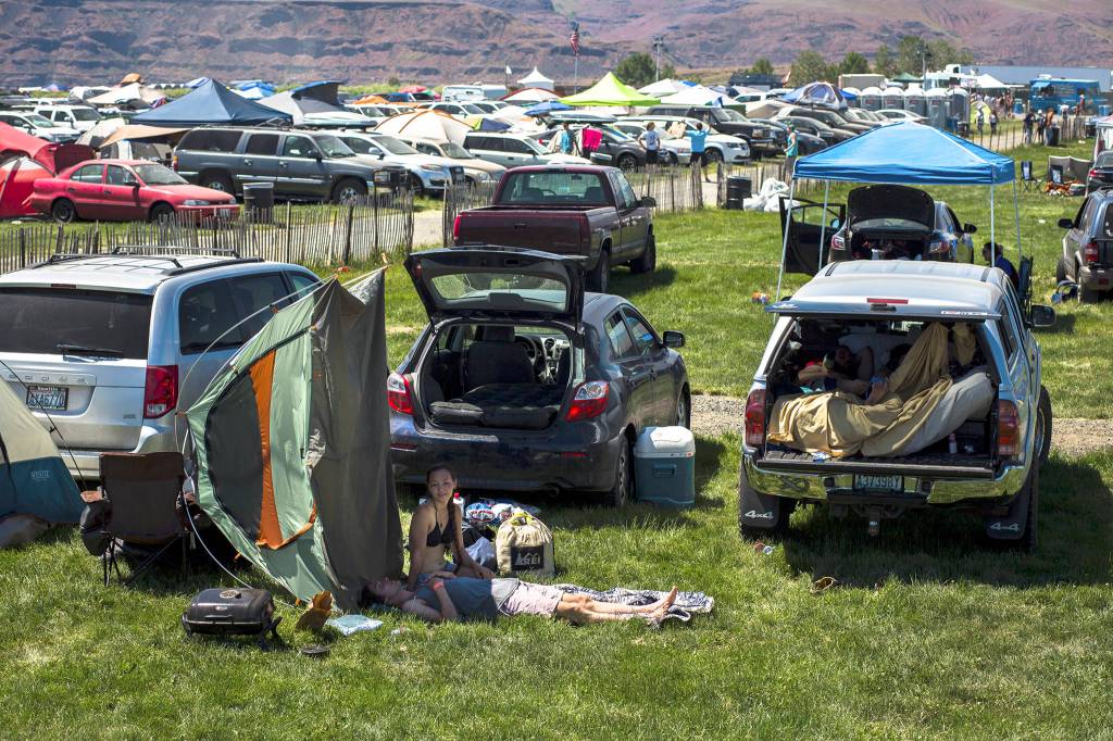 Fans relax before heading into the grounds during day three of the annual Sasquatch! music festival on May 28 in George. (Daniella Beccaria / For the Herald )