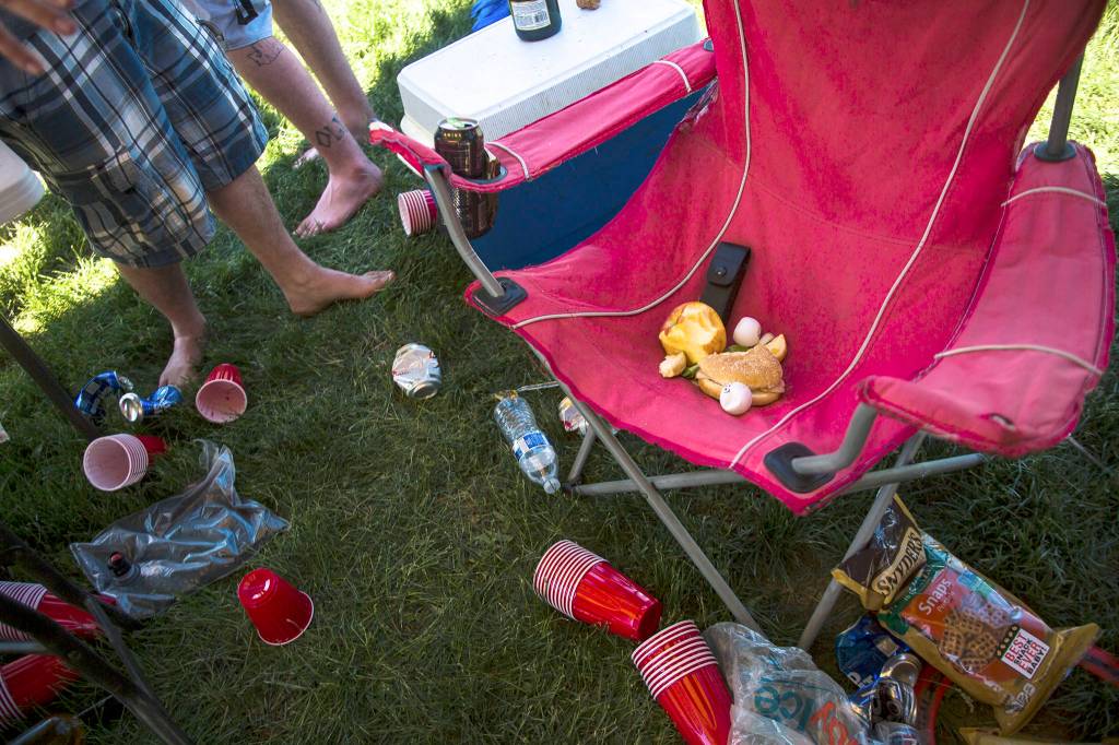 Leftover food and drinks scatter the campground on day three of the annual Sasquatch! music festival on May 28 in George. (Daniella Beccaria / For the Herald )