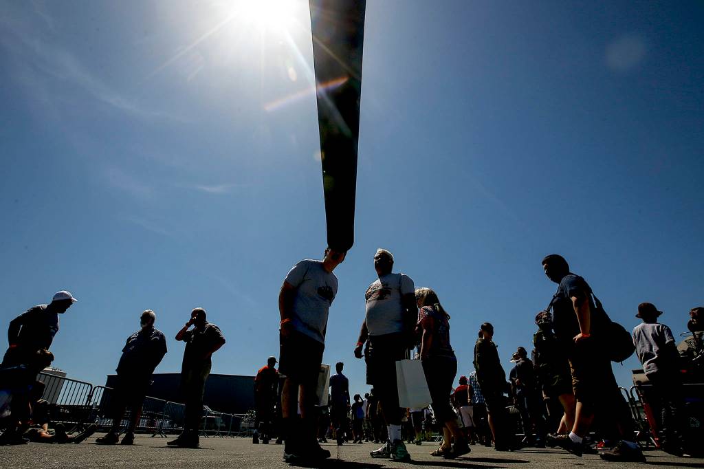 Attendants of Tankfest Northwest look through the barrel of a M2 155mm field gun on May 27 at the Flying Heritage and Combat Armor Museum in Everett. (Ian Terry / The Herald)