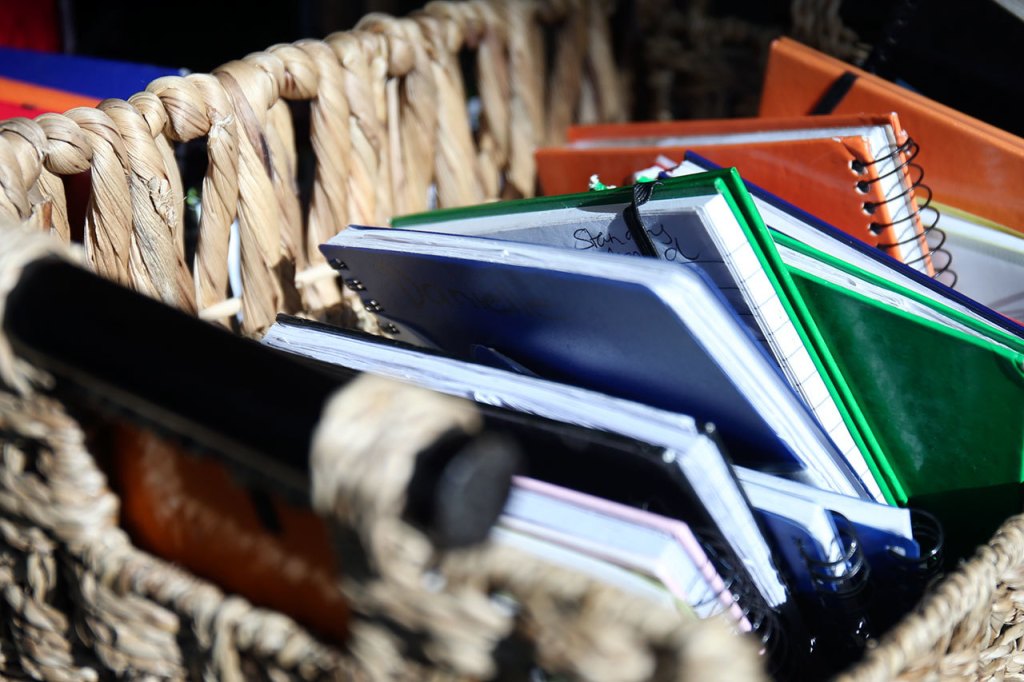 Clients workout logs at Immortals Fitness. (Kevin Clark / The Herald)
