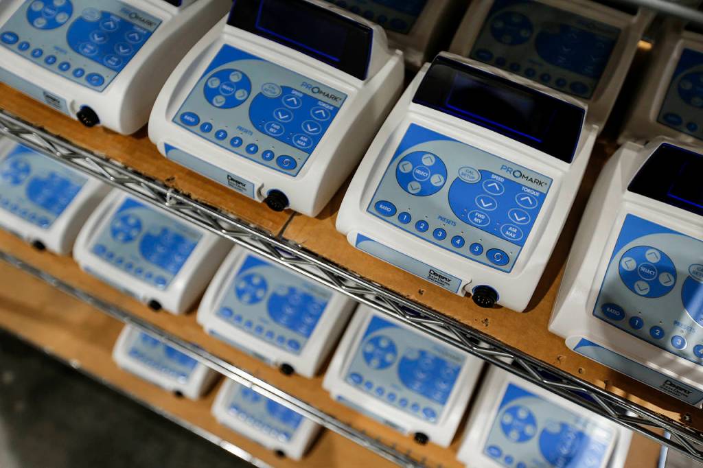 Endodontic system units line racks at Aseptico&rsquo;s factory in Woodinville. Aseptico, which makes portable dental equipment, won a major export award. (Ian Terry / The Herald)
