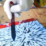 Ball paints outside Solie Funeral Home & Crematory as part of the Everett Art Walk. (Kevin Clark / The Herald)