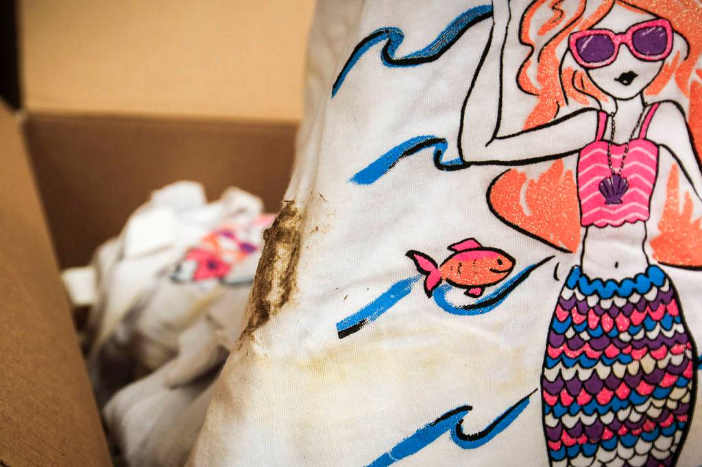 A piece of clothing is seen with mold and water damage. (Ian Terry / The Herald)