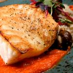 Pan Seared Sea Bass with roasted carrot puree, porcini mushroom risotto and beet chips. (Kevin Clark / The Herald)