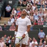 Rafael Nadal reacts during his singles match Monday against Luxembourg&rsquo;s Gilles Muller at the Wimbledon Tennis Championships in London. Nadal lost, 6-3, 6-4, 3-6, 4-6, 15-13. (AP Photo/Tim Ireland)