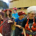 Members of the Seattle Raging Grannies finish their presentation at a Seattle City Council meeting, where a city income tax on the wealthy was being considered on Monday. The women sang a song in support of the measure, which was approved. (AP Photo/Elaine Thompson)