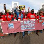 Thousands march to Nissan Motor Co.&rsquo;s Canton, Mississippi, plant after a pro-union rally March 4. (AP Photo/Rogelio Solis)