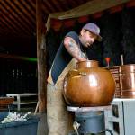 Zion Hilliker, co-owner of B&B Family Farm, readies some lavender for distillation prior to last year&rsquo;s Sequim Lavender Weekend. The farm&rsquo;s Hidcote pink lavender and Grosso lavender received gold certification from the U.S. Lavender Oil Awards. (Sequim Gazette file photo by Matthew Nash)