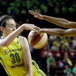 Connecticut Sun&rsquo;s Jasmine Thomas (right) knocks away a pass by Seattle&rsquo;s Breanna Stewart in the second half of their WNBA game Wednesday in Seattle. The Sun won, 83-79. (AP Photo/Elaine Thompson)