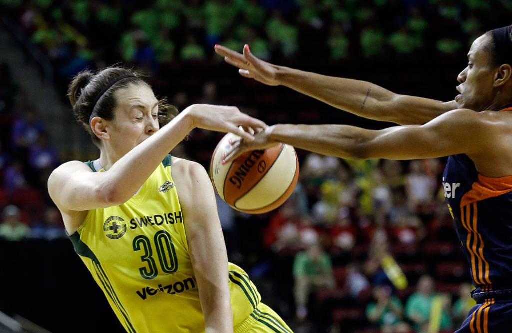 Connecticut Sun&rsquo;s Jasmine Thomas (right) knocks away a pass by Seattle&rsquo;s Breanna Stewart in the second half of their WNBA game Wednesday in Seattle. The Sun won, 83-79. (AP Photo/Elaine Thompson)
