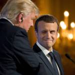 French President Emmanuel Macron winks at President Donald Trump during a joint news conference at the Elysee Palace in Paris on Thursday. (AP Photo/Carolyn Kaster)