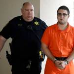 A law enforcement official escorts Cosmo DiNardo to a vehicle Thursday in Doylestown, Pennsylvania. (AP Photo/Matt Rourke)
