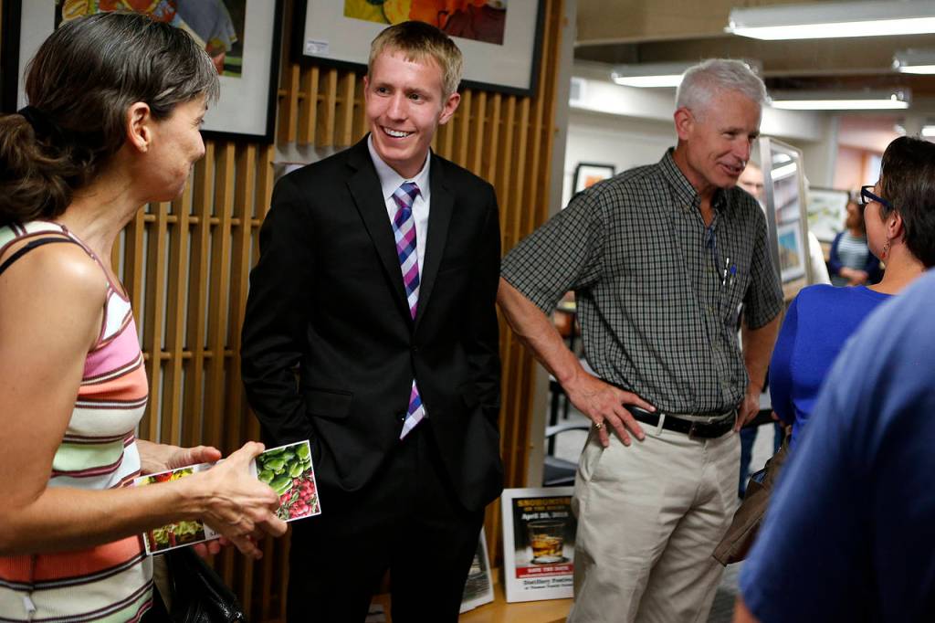 Snohomish County Council District 1 candidate Nate Nehring (center left) at a public event held at GroWashington in Everett on July 19. (Ian Terry / The Herald)