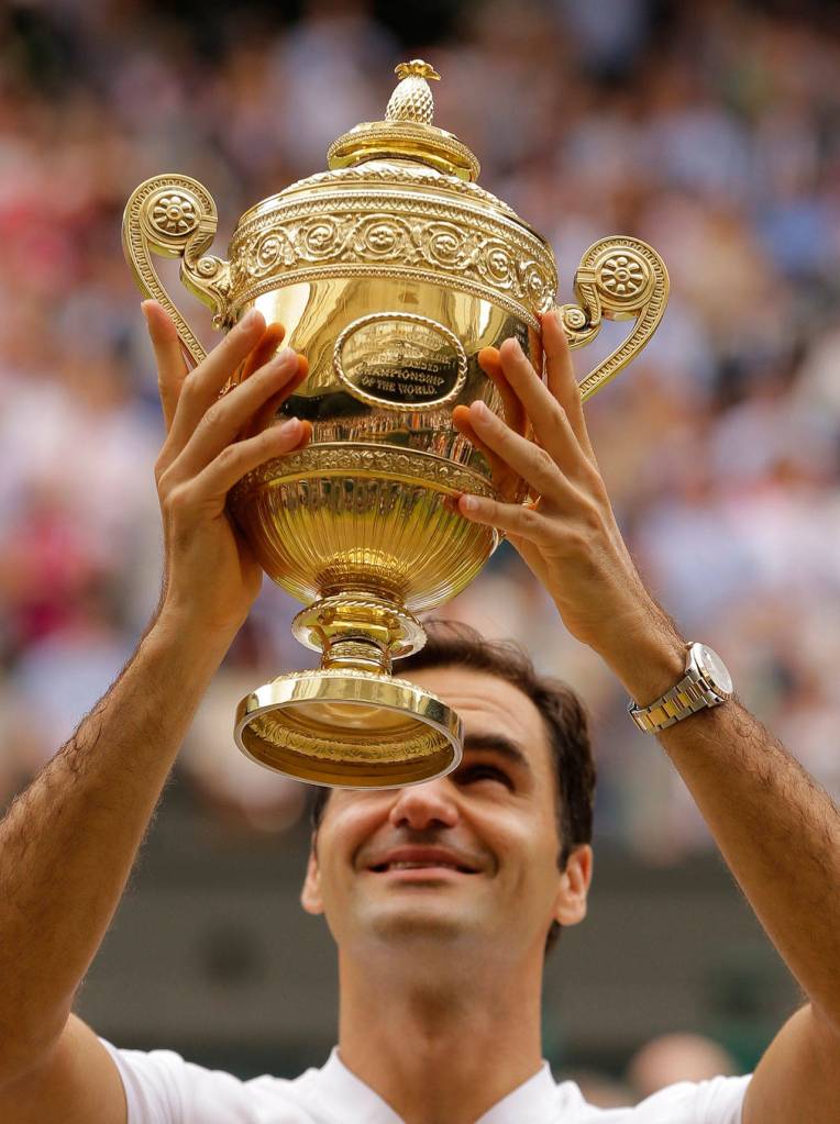 Switzerland&rsquo;s Roger Federer holds the trophy after beating Croatia&rsquo;s Marin Cilic in the Men&rsquo;s Singles final match on day thirteen at the Wimbledon Tennis Championships in London Sunday, July 16, 2017. (AP Photo/Alastair Grant)