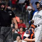The Mariners&rsquo; Guillermo Heredia (right) reacts to a called strike by home plate umpire Dan Bellino during the fifth inning of a game against the Astros on July 18, 2017, in Houston. (AP Photo/Eric Christian Smith)