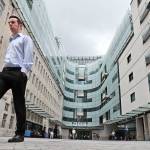A man walks outside the main entrance to the headquarters of the publicly funded BBC in London on Wednesday. (AP Photo/Frank Augstein)