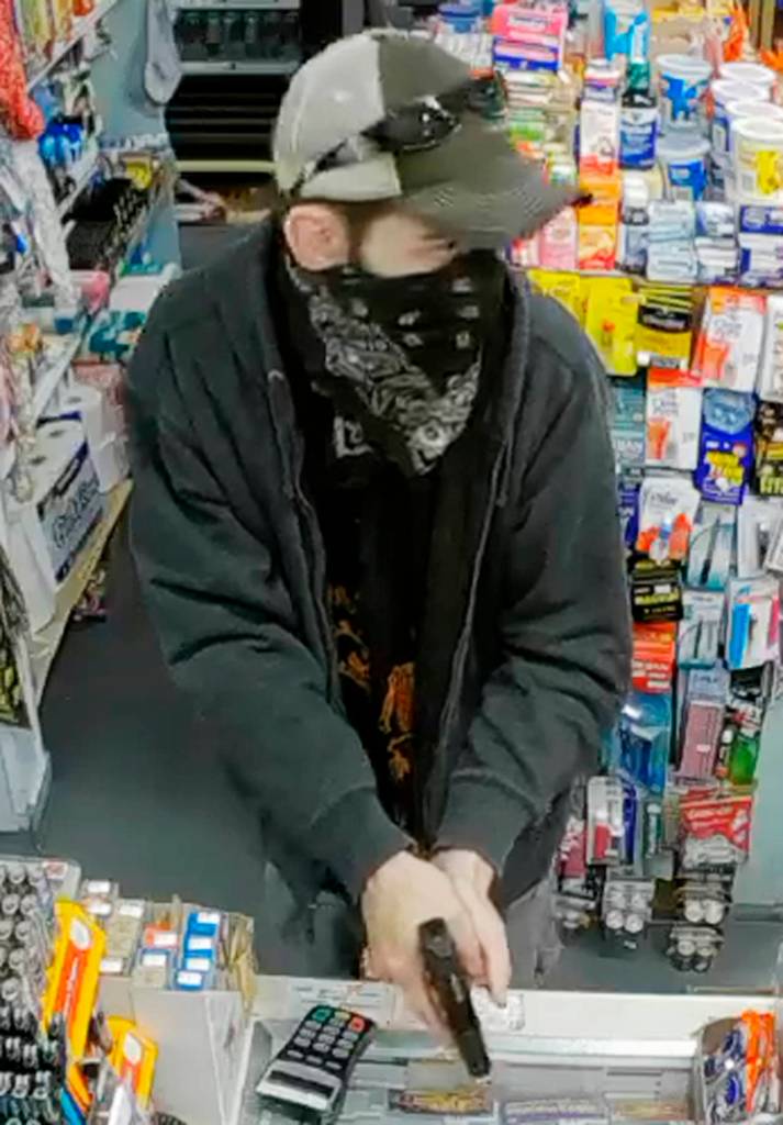 Police are hoping to identify a minimart robber who struck in June. (Everett Police Department)