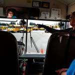 Jenny Lagadinos (center right), a driver and trainer for the Marysville School District, gives instructions to Sue Hubbard (left), of Granite Falls, as fellow trainee Margaret Mitchell (right), of Arlington, looks on while training in Marysville on Thursday, July 27. (Ian Terry / The Herald)