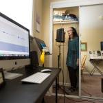 A computer records her voice as Saacha K. Belgar uses her closet as a recording studio when she needs to dampen sound more than usual on Wednesday, May 24, 2017 in Snohomish, Wa. (Andy Bronson / The Herald)