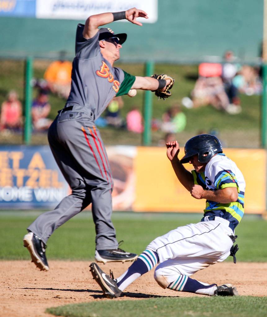 Everett&rsquo;s Joe Venturino slides safely in second base pass the errant throw to Boise&rsquo;s Matt McLaughlin Sunday afternoon at Everett Memorial Stadium in Everett on July 23, 2017. Aquasox won 11-5. (Kevin Clark / The Herald)