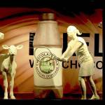 A traditional butter cow and calf that are now accompanied by four young student-athletes and a larger-than-life bottle of the official beverage that fuels them, chocolate milk. (American Dairy Association Mideast via AP)