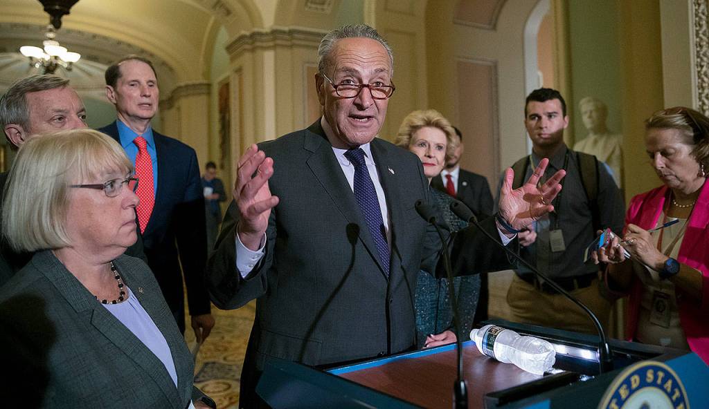 Senate Minority Leader Chuck Schumer, D-New York, is joined by (from left) Sen. Patty Murray, D-Washington, Sen. Dick Durbin, D-Illinois, Sen. Ron Wyden, D-Oregon, and Sen. Debbie Stabenow, D-Michigan, as he speaks with reporters after Vice President Mike Pence broke a 50-50 tie to start debate of Republican legislation to tear down much of the Affordable Care Act on Capitol Hill in Washington on Tuesday. (AP Photo/J. Scott Applewhite)