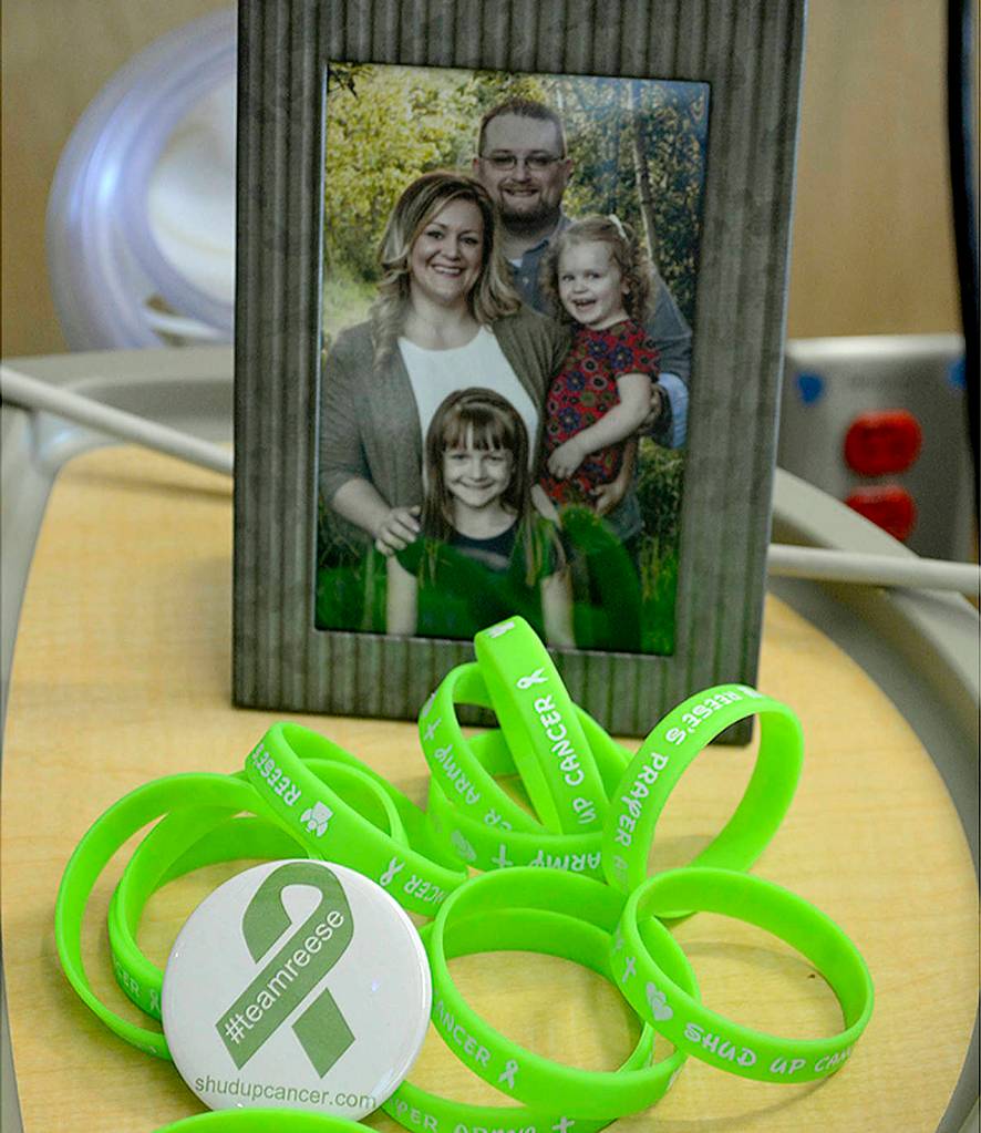 Support bracelets for Reese are lime green and have the Estes family&rsquo;s motto on them: &ldquo;Shud Up Cancer.&rdquo; (Photo by Steven Powell / Marysville Globe)