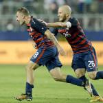 Jordan Morris (8) and Michael Bradley celebrate after Morris&rsquo; late goal that gave the United States a 2-1 win over Jamaica in the Gold Cup final Wednesday in Santa Clara, California. (AP Photo/Ben Margot)