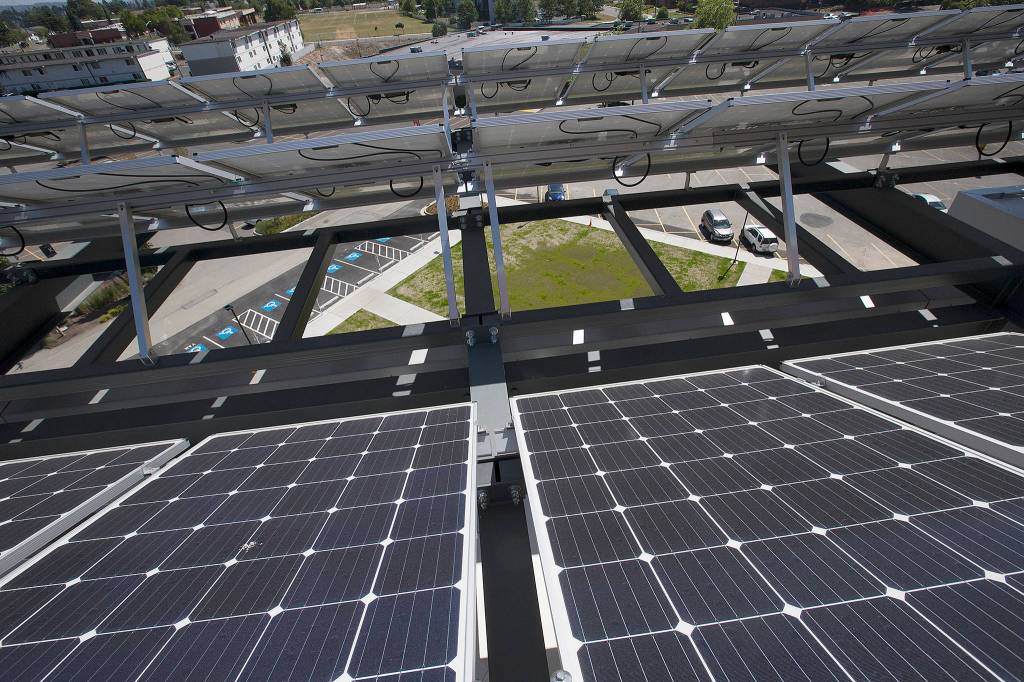 This June 29 photo shows solar panels on a new four-story building at WSU North Puget Sound at Everett. (Andy Bronson / The Herald)