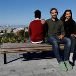 Mike Gougherty, center, and Julie Rajagopal, right, pose for photos with their 16-year-old foster child from Eritrea at Dolores Park in San Francisco. When their 16-year-old foster child landed in March, he was among the last refugee foster children to make it into the U.S. Trump administration travel bans declared to block terrorists also are halting a small, three-decade-old program bringing orphan refugee children to waiting foster families in the United States. (AP Photo/Jeff Chiu)