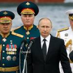 Russian President Vladimir Putin (center) Defense Minister Sergei Shoigu (left) Commander-in-Chief of the Russian Navy Vladimir Korolev (right) and Commander of Western military district Andrei Kartapolov attend the military parade during the Navy Day celebration in St.Petersburg, Russia, on Sunday. (AP Photo/Alexander Zemlianichenko, Pool)