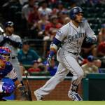 Rangers&rsquo; catcher Robinson Chirinos (left) and Mariners&rsquo; Robinson Cano (right) watch Cano&rsquo;s two-run single in the ninth inning of a Monday&rsquo;s game in Arlington, Texas. (AP Photo/Tony Gutierrez)
