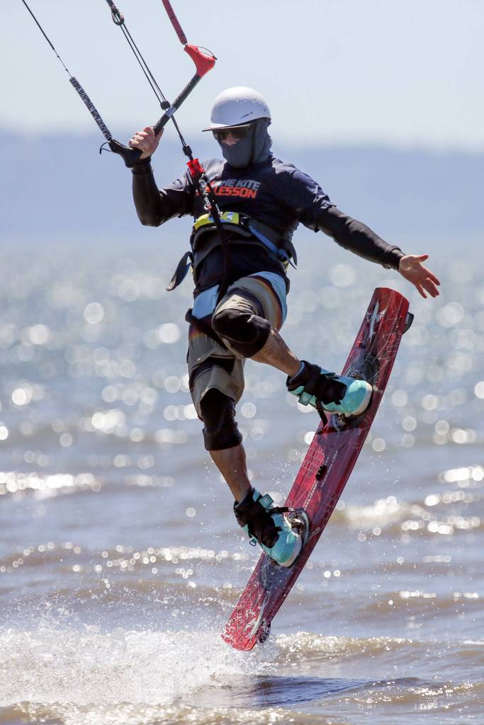 Matt Ewing grabs air during the Jetty Island Light Wind Olympics 2017 on Jetty Island on June 23. (Kevin Clark / The Herald)