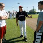 Kim Hammons (center) talks to his two sons, Nick (left) and Jake, after coaching a baseball game in June 2010 in Snohomish. The elder Hammons has retired after 25 seasons leading the Panther program. (Jennifer Buchanan / The Herald)