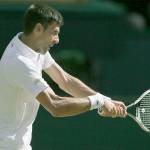 Novak Djokovic fought through some early issues with the chair umpire to beat Ernests Gulbis in straight sets in the third round of the Wimbledon men&rsquo;s singles championship Saturday in London. (AP Photo/Tim Ireland)
