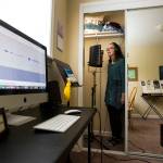 Voice artist Saacha K. Belgar uses her closet as a recording studio May 24 in Snohomish. (Andy Bronson / The Herald)