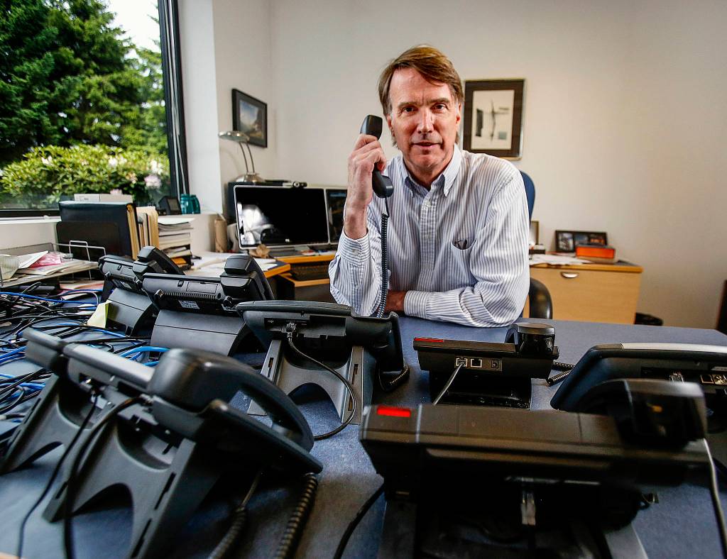 As president of Teo Technologies in Mukilteo, Steve Hill can have as many telephones as he wants on his office desk, including some really high tech ones that can help defend against wiretapping. (Dan Bates / The Herald)