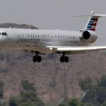 An American Eagle regional jet is seen through heat ripples as it lands at Sky Harbor International Airport on June 19 in Phoenix. (AP Photo/Matt York)