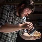 Narrative Coffee owner and head barista Maxwell Mooney at his business in Everett. Mooney said one latte in Kirkland stirred his interest in coffee. (Andy Bronson / The Herald)