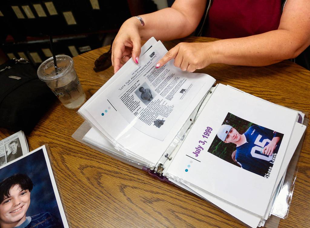 Glenda Lynch, of Lake Stevens, carries and shares a notebook filled with critical information about the dangers of fireworks as well as the story of her son. (Dan Bates / The Herald)