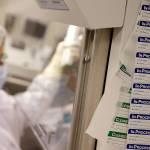 In this photo taken March 29, 2017, a technician works in the cell processing facility at the Fred Hutchinson Cancer Research Center in Seattle. (AP Photo/Elaine Thompson)