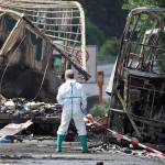 Police work at the burned-out shell of a bus near Muenchberg, Germany, on Monday. (Nicolas Armer/dpa via AP)