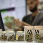 A cashier rings up a marijuana sale at the Essence cannabis dispensary Saturday in Las Vegas. (AP Photo/John Locher)