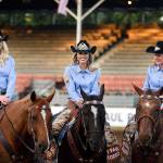 St. Paul Rodeo Princess Morgan Spear (from left), Queen Melanie Atchison and Princess Britney Norby sit on their horses, Dally, Shady and Huckleberry, as they wait for more television interviews to begin last month. Norby credits her duties as a princess on the court with giving her more confidence in public speaking. (Molly J. Smith / Statesman-Journal)