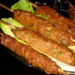 Seekh kebabs are made by wrapping seasoned ground meat around skewers so that they resemble sausage on sticks. (Reshma Seetharam / For The Herald)