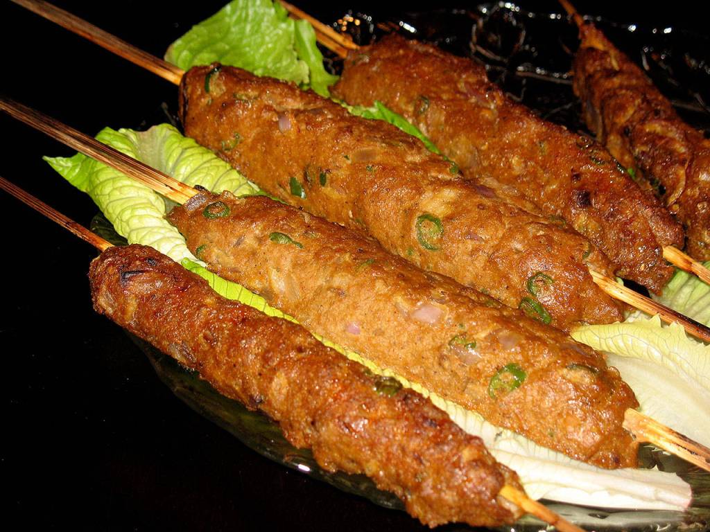 Seekh kebabs are made by wrapping seasoned ground meat around skewers so that they resemble sausage on sticks. (Reshma Seetharam / For The Herald)