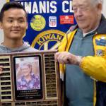 Lynnwood Kiwanis member Ralph Baggerly congratulates Edmonds-Woodway High School graduating senior Jinsung Lee on receiving the $1,500 Helen Olsen Scholarship from the Kiwanis House foundation. (Contributed photo)