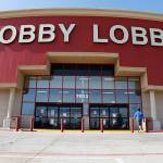 In this 2014 photo, customers walk to a Hobby Lobby store in Oklahoma City. (AP Photo/Sue Ogrocki, File)