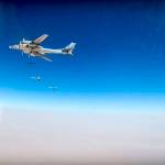 In this photo made from the footage taken from Russian Defense Ministry official website on Wednesday, Russian strategic T-95 bomber, with Russian jet fighters at rear, launches X-101 cruise missiles on IS facilities in the area along the boundary between the provinces of Hama and Homs in Syria. (Russian Defense Ministry Press Service/ Photo via AP)
