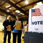 In this 2016 photo, people line up to vote in the primary at a precinct in Bradfordton, Illinois. (AP Photo/Seth Perlman, File)